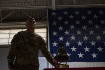 Airman Charles Dell, 5th Civil Engineering Squadron fire fighter apprentice, rings the alarm bell at Minot Air Force Base, North Dakota, Sept. 11, 2023. Dell rang the alarm bell as a reminder of the first responders that lost their lives in the line of duty. (U.S. Air Force photo by Airman 1st Class Trust Tate)