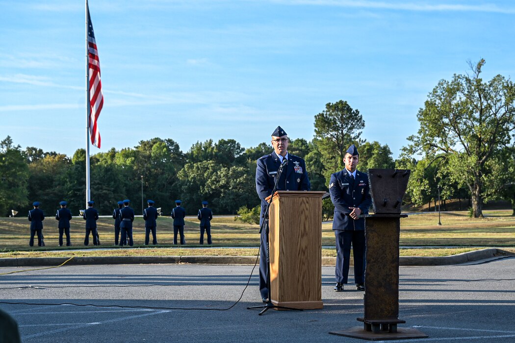 Deputy Commander speaks behind a podium.