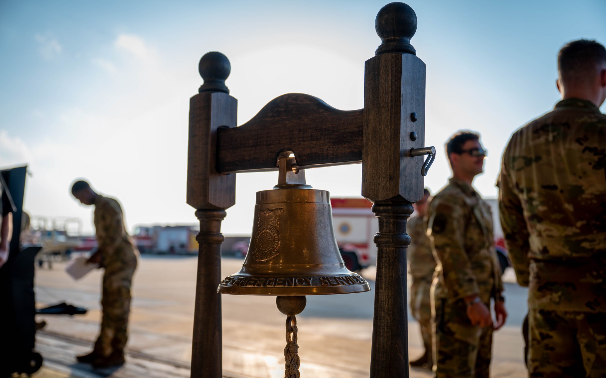 Ceremonial bell stands in hangar.