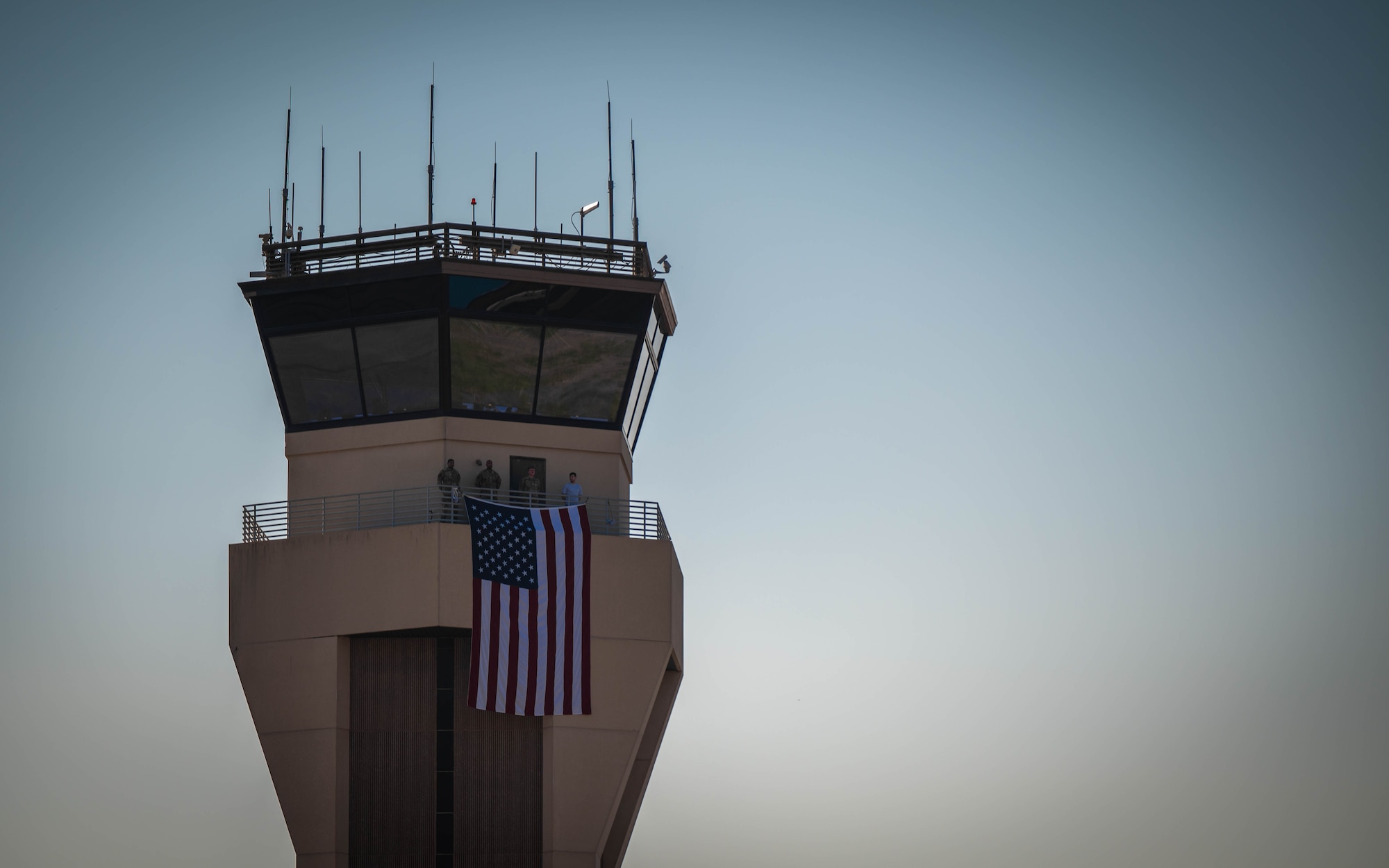 Air Traffic Control tower has a flag hung on its rail
