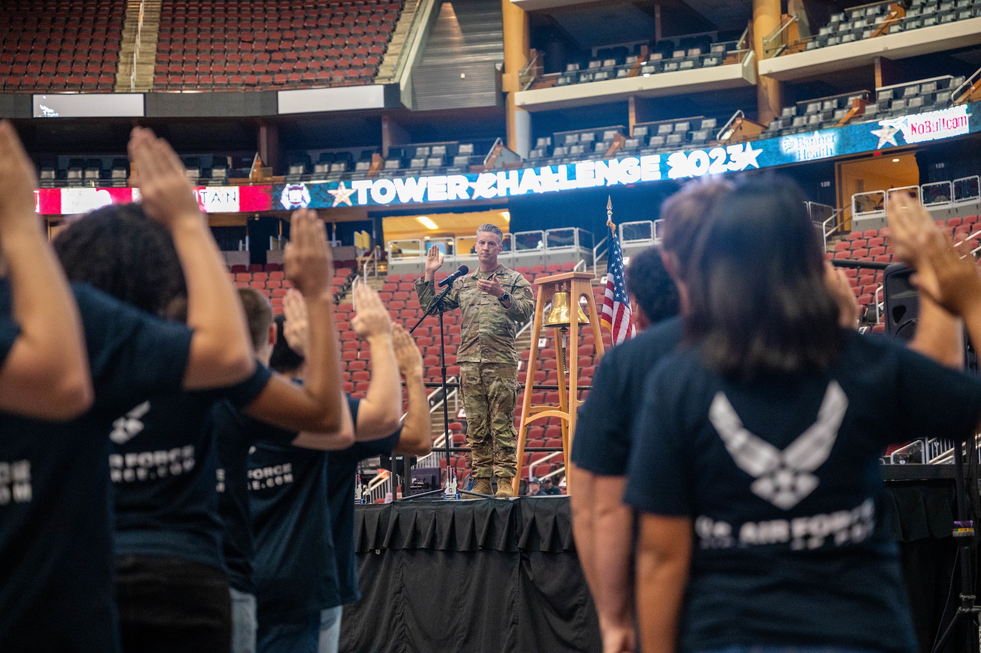U.S. Air Force Col. Keagan McLeese, 56th Fighter Wing deputy commander, administers the Oath of Enlistment to Air Force recruits during the 9/11 Tower Challenge, Sept. 11, 2023, at Desert Diamond Arena, Glendale, Arizona.