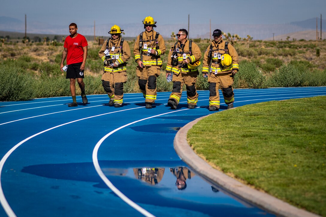 Firefighters from the 812th Civil Engineer Squadron participate in the 9/11 Memorial Run, Walk, Ruck March event, Sept. 11, on Edwards Air Force Base, California. (Air Force photo by Giancarlo Casem)