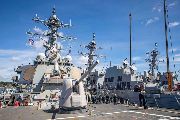 Yokosuka, Japan (Aug. 31, 2023) Sailors heave a line aboard the Arleigh Burke-class guided-missile destroyer USS Benfold (DDG 65) during a sea and anchor detail in Yokosuka, Japan on Aug. 31. Benfold is assigned to Commander, Task Force (CTF) 71/Destroyer Squadron (DESRON) 15, the Navy’s largest forward-deployed DESRON and the U.S. 7th Fleet’s principal surface force. (U.S. Navy photo by Mass Communication Specialist 2nd Class Justin Stack)