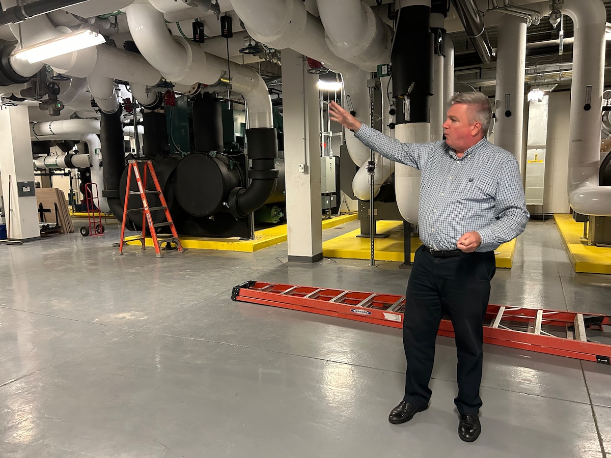 Brian Schafer, deputy division chief, Digital Capabilities Directorate, Air Force Research Laboratory, or AFRL, discusses water-cooling system logistics for the Raider, the directorate’s newest supercomputer housed at Wright-Patterson Air Force Base, Ohio, Aug. 29, 2023. The Raider, also known as a technology insertion, or TI-21, system is part of the DOD High Performance Computing Modernization Program. The supercomputer system is a national resource to which the U.S. Air Force, Army and Navy each have access. Recently, AFRL’s Digital Capabilities Directorate placed an order for the next supercomputer, which will be delivered in 2024. The next two systems to be installed are the TI-23 Flyer and TI-23 Raven will operate as unclassified and classified systems, respectively. (U.S. Air Force photo / Aleah M. Castrejon)