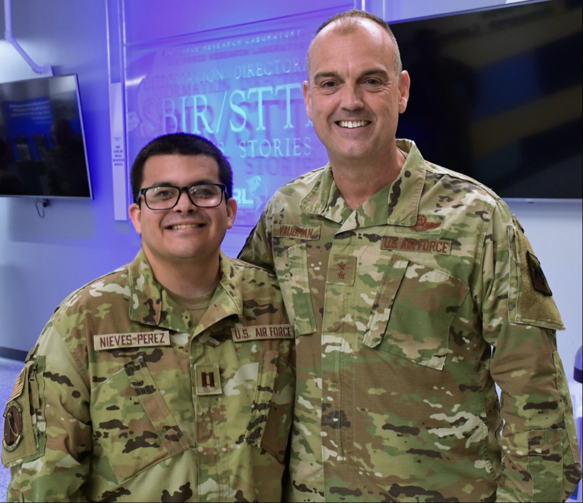 Air Force Major General Edward Vaughan, director of space operations for the National Guard Bureau, poses for a photo with Capt. Juan Carlos Nieves-Perez.