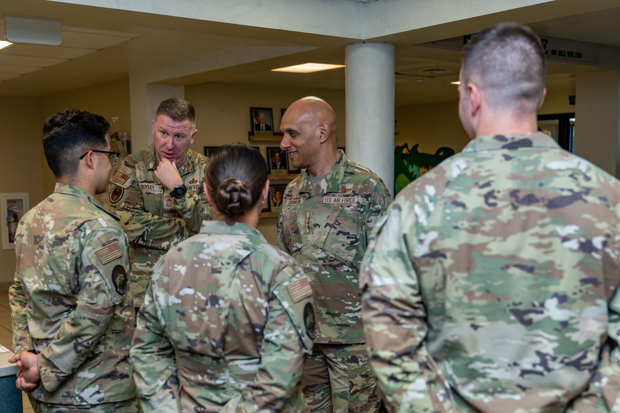 U.S. Air Force Lt. Gen. Brian Robinson, commander of Air Education and Training Command, and Chief Master Sgt. Chad Bickley, AETC command chief, speaks with Airmen in the 334th Training Squadron dormitory at Keesler Air Force Base