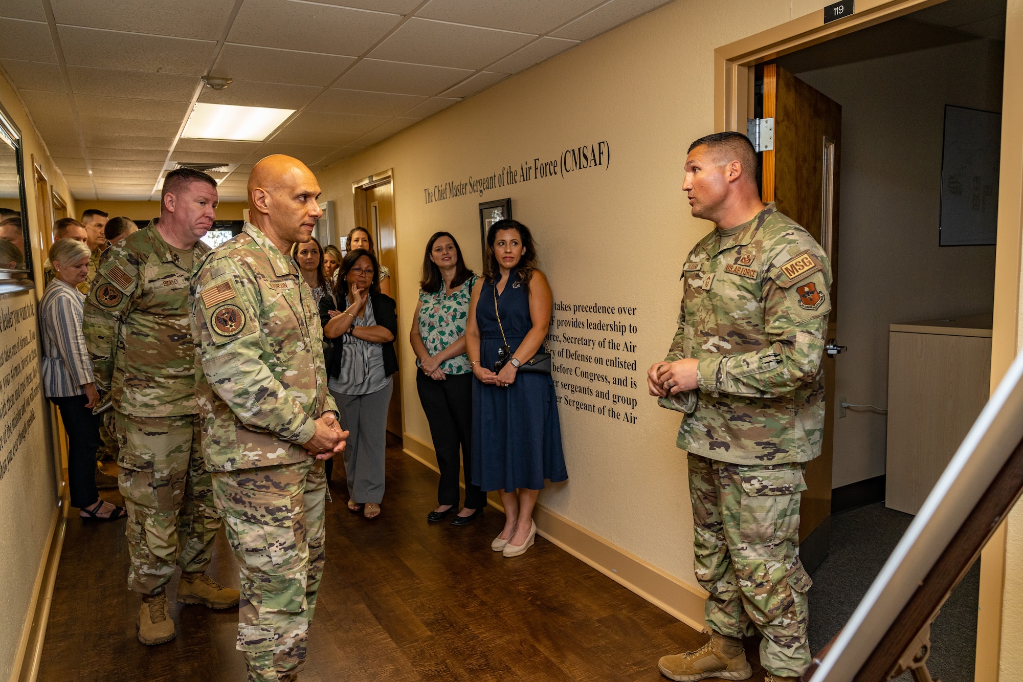 U.S. Air Force Chief Master Sgt. Ron Oudean, 81st Mission Support Group senior enlisted leader, briefs Lt. Gen. Brian Robinson, commander of Air Education and Training Command, on Dragon University at the Professional Development Center at Keesler Air Force Base