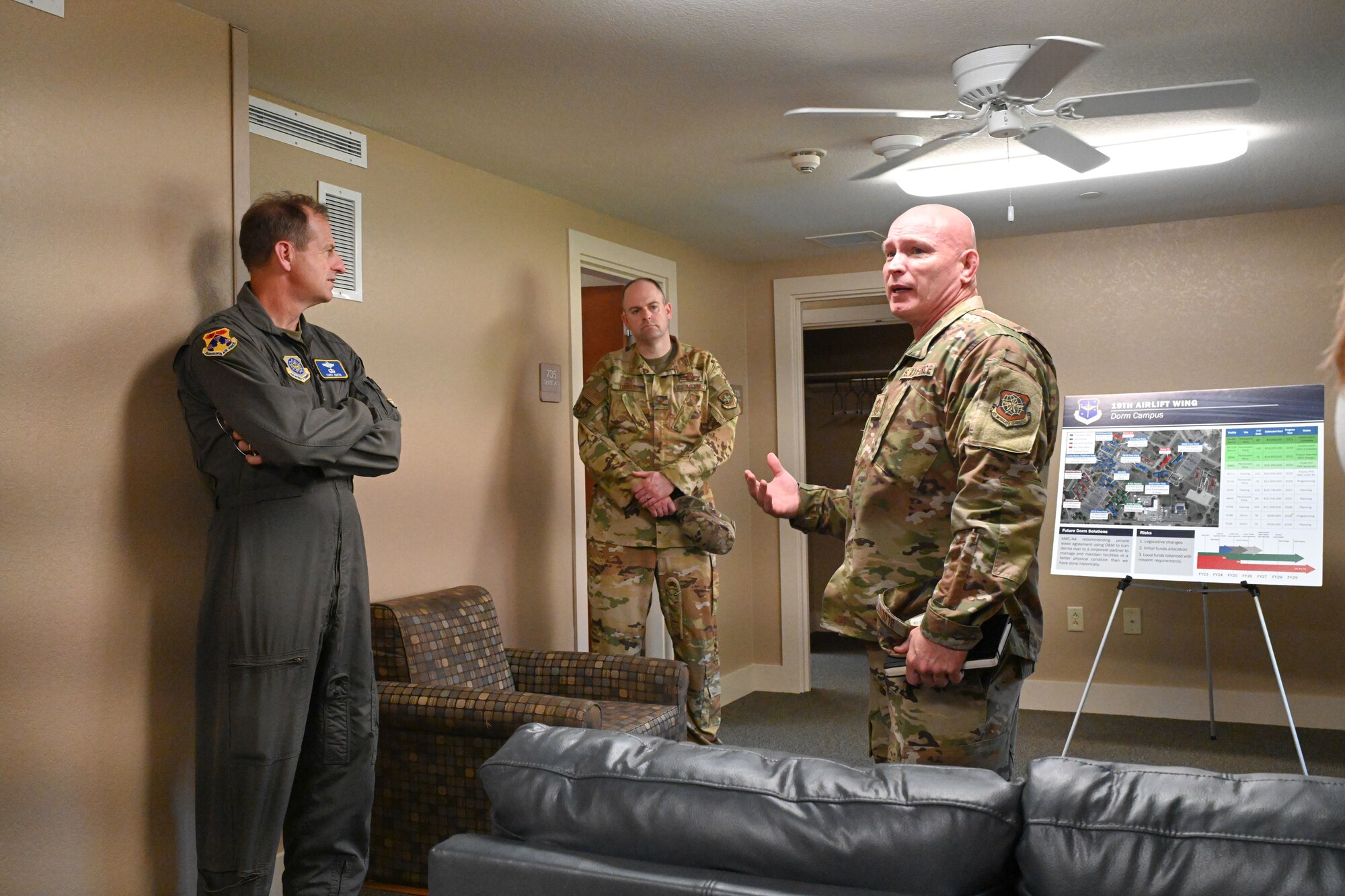 Men in uniform view dorms