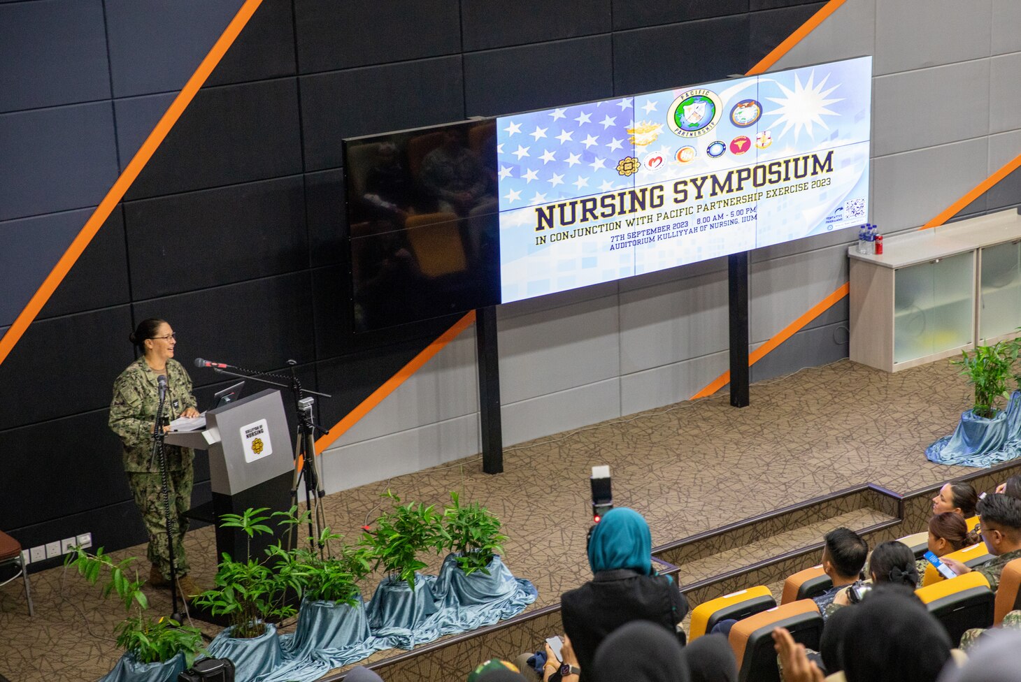 Capt. Claudine Caluori, Pacific Partnership 2023 mission commander, delivers remarks at a nursing symposium at Kulliyyah of Nursing, International Islamic University Malaysia.