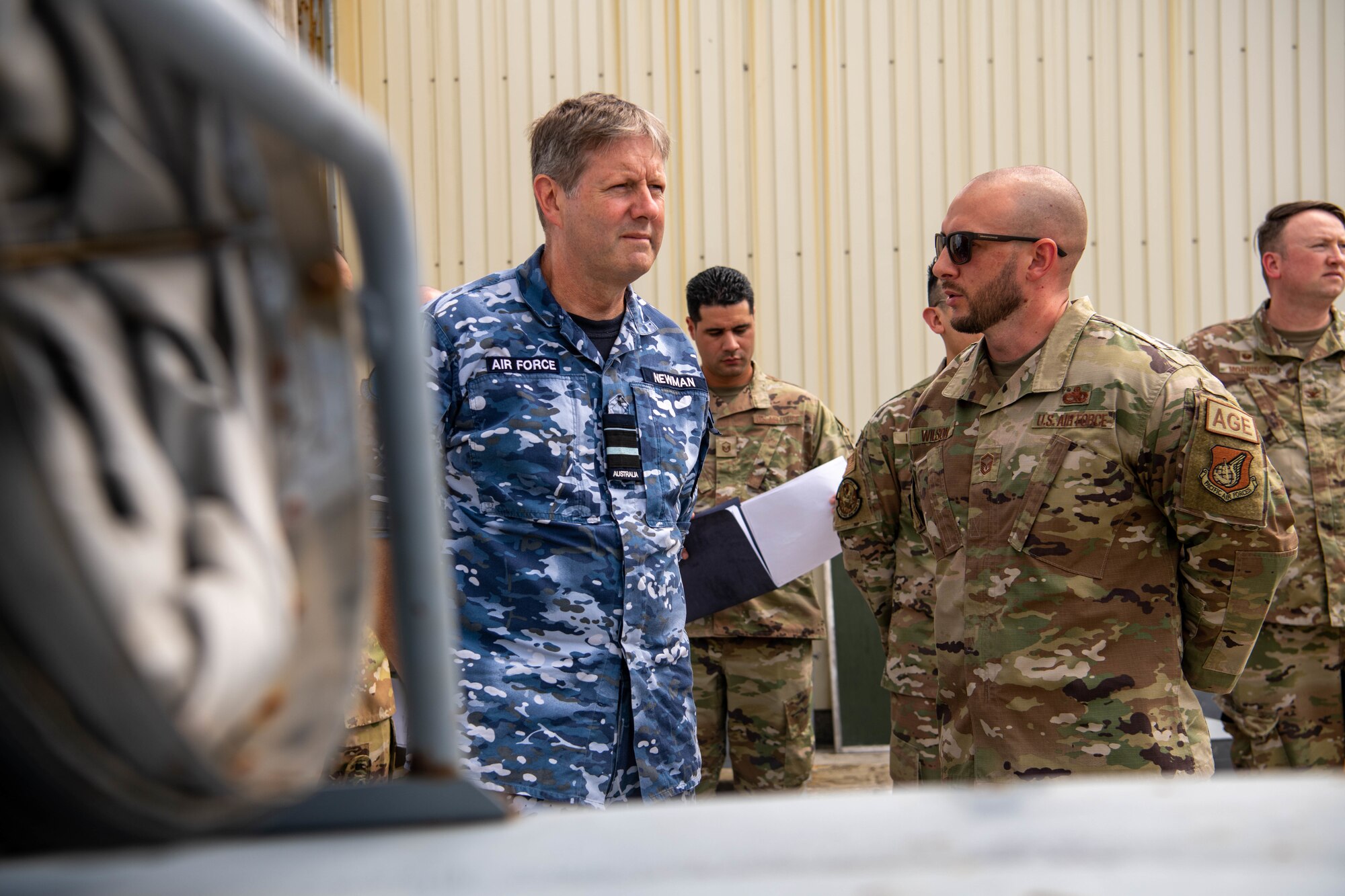 Royal Australian Air Force Air Vice-Marshal speaks with aircraft ground equipment flight chief