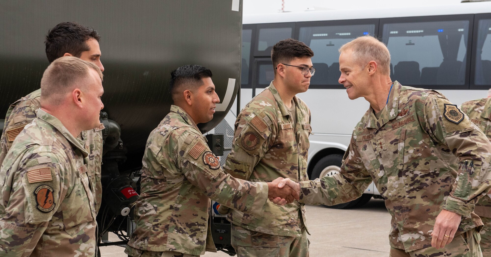 Maj. Gen. Derek C. France coins Airmen assigned to the 86th Logistics Readiness Squadron and 52nd Logistics Readiness Squadron