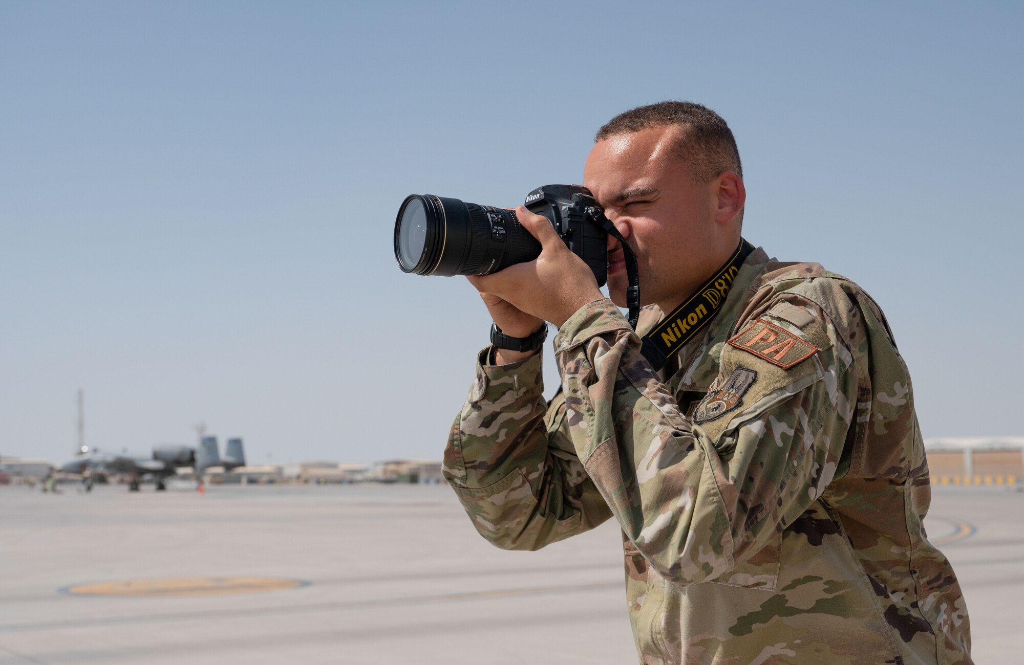 A photo of an Airman taking a photo