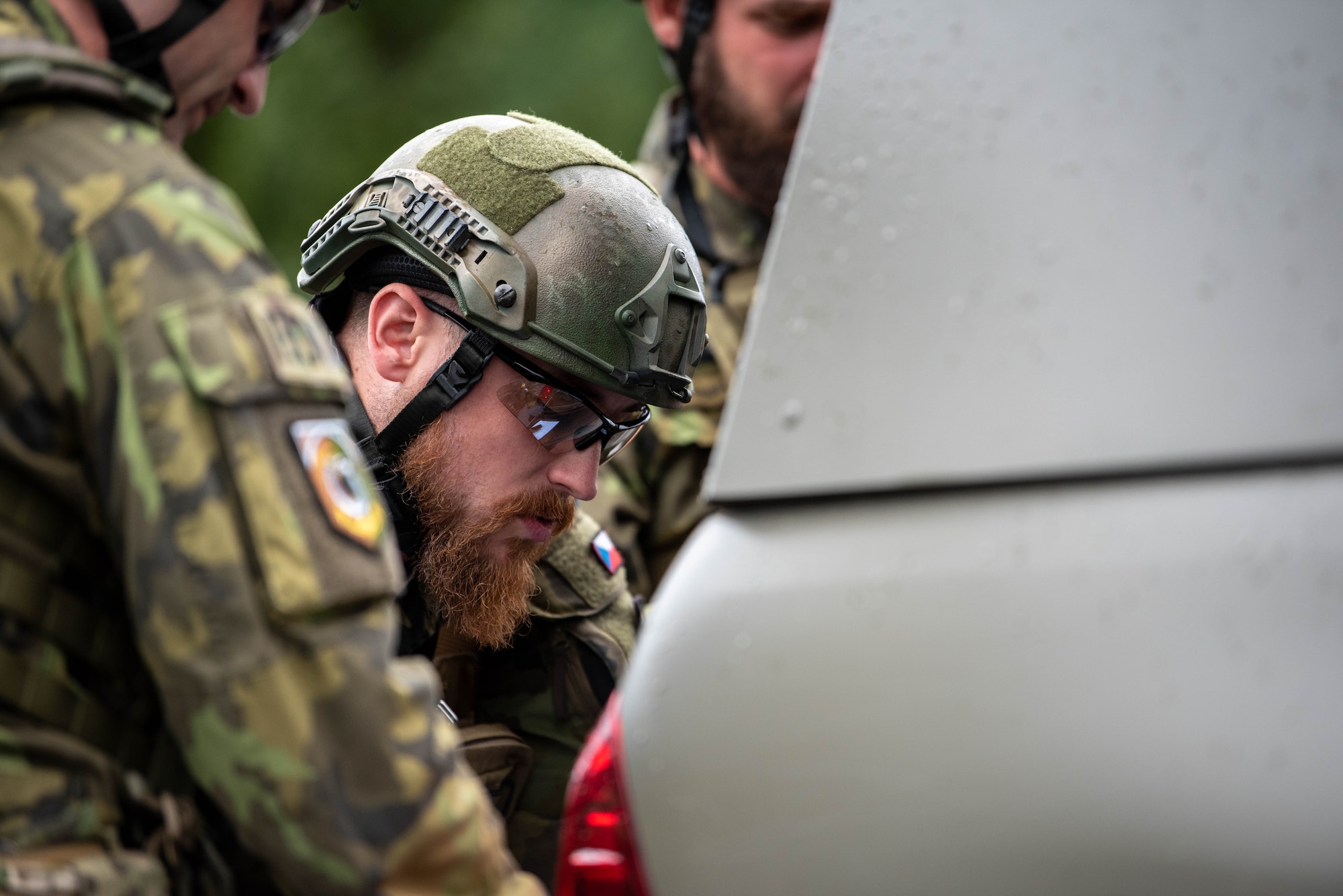 A Czech Republic Explosive Ordnance Disposal team coordinates a plan to disarm a simulated Improvised Explosive Device (IED) during an annual IED Rodeo exercise at Spangdahlem Air Base, Germany, Aug. 14, 2023.