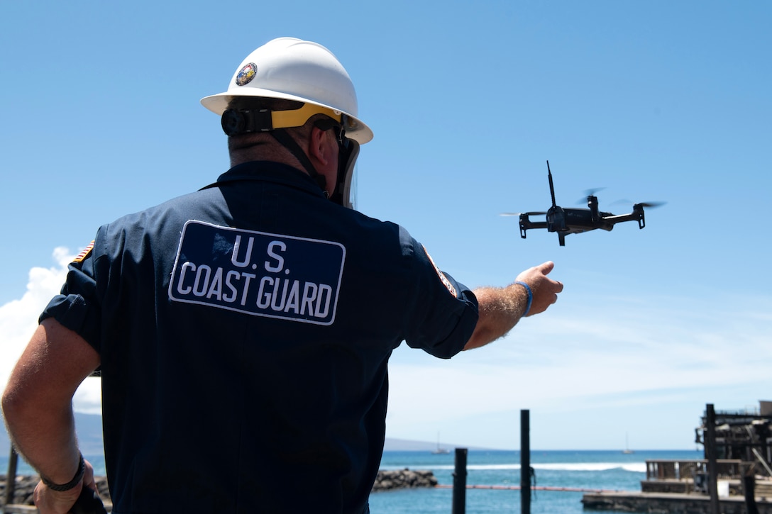 A Coast Guardsman deploys an unmanned aircraft system.