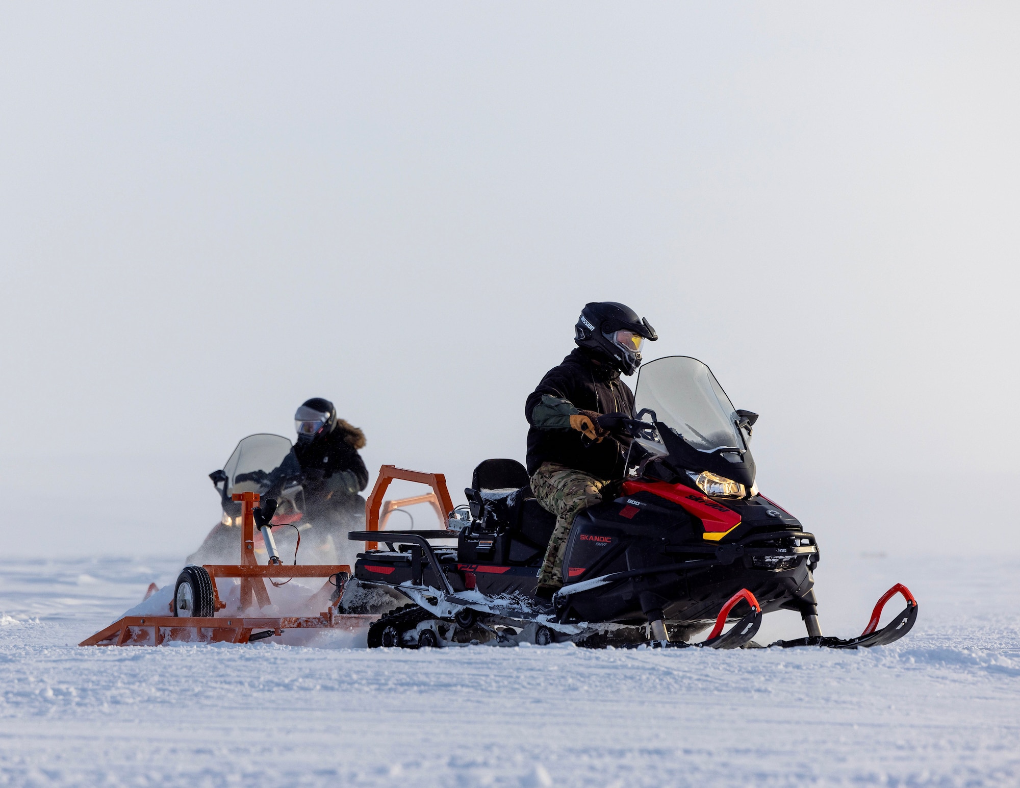 U.S. Air Force Master Sgt. Brian Shuey, 133rd Contingency Response Flight, grooms the ski landing area in Resolute Bay, Nunavut, Canada, March 12, 2023.