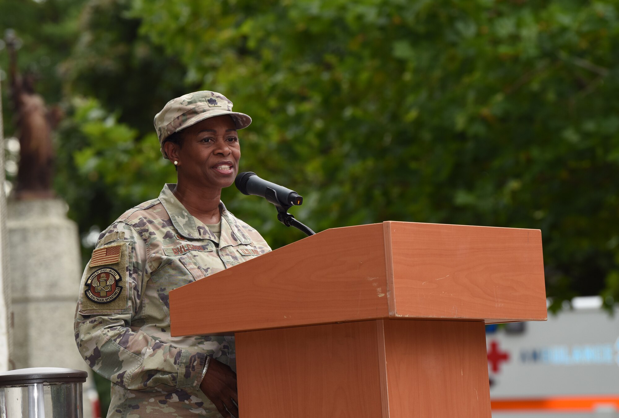 U.S. Air Force Lt. Col. Jacqueline Bvlgari, 48th Healthcare Operations Squadron commander, shares her personal story of being a medic at a deployed location on Sept. 11, 2001, at the 9/11 memorial ceremony at Royal Air Force Lakenheath, England, Sept. 11, 2023. Bvlgari’s actions that day earned her a Purple Heart. The ceremony honored the fallen from the Sept. 11 terrorist attacks and marked the 22nd anniversary of the tragic events. (U.S. Air Force photo by Karen Abeyasekere)