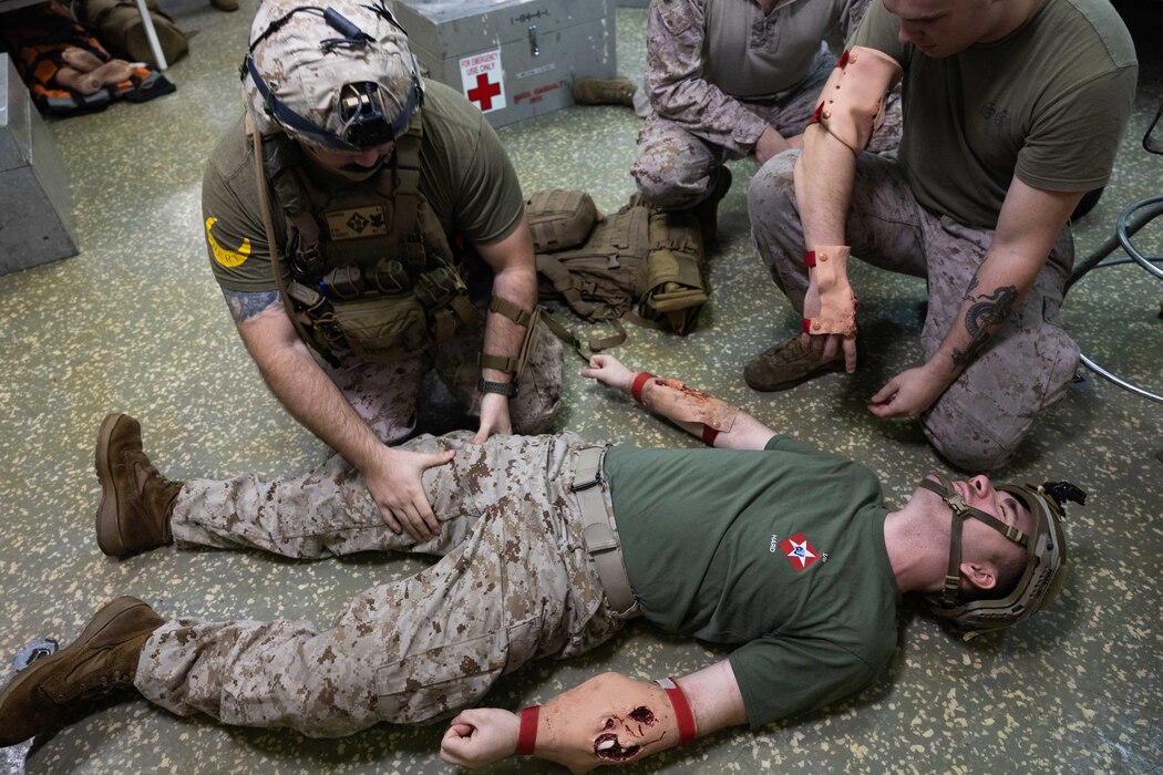 ARABIAN GULF (Aug. 22, 2023) Hospital Corpsman 2nd Class Kyle Ramsey, assigned to the 26th Marine Expeditionary Unit (MEU), practices medical care procedures on a simulated patient aboard amphibious assault ship USS Bataan (LHD 5) in the Arabian Gulf, Aug. 22, 2023. Components of the Bataan Amphibious Ready Group and 26th MEU are deployed to the U.S. 5th Fleet area of operations to help ensure maritime security and stability in the Middle East region. (U.S. Navy photo by Mass Communication Specialist 3rd Class Alisha Gleason)