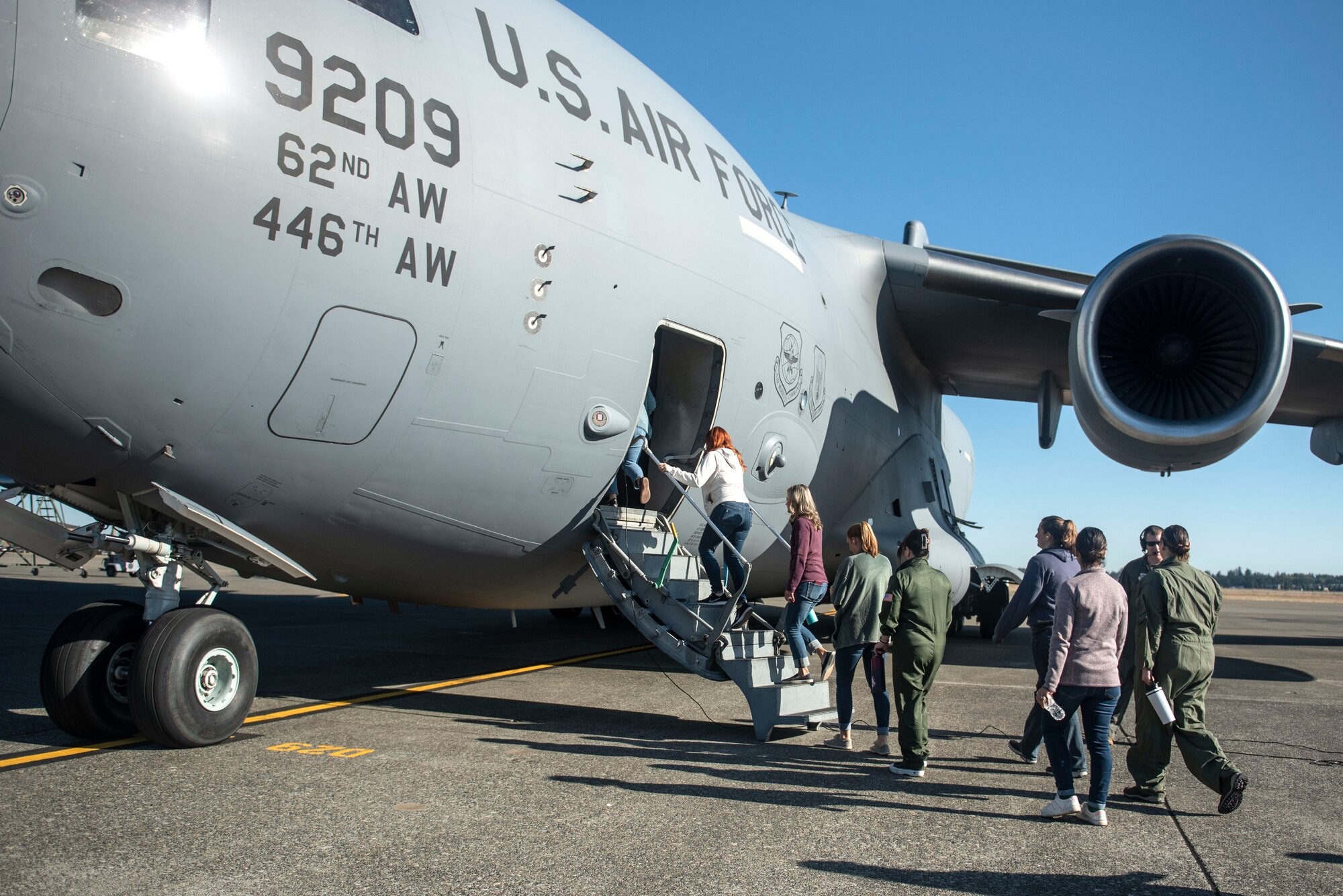 Spouses day provided a unique opportunity for service members’ spouses to receive a mission brief and participate in a flight on a C-17 Globemaster III. (U.S. Air Force photos by Airman 1st Class Kylee Tyus)