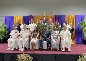 20230908-N-IK388-0047 CARIBBEAN SEA (Sept. 8 2023) The U.S. Ambassador to Trinidad and Tobago, Candace Bond, poses with Rear Adm. James Aiken and members of the Continuing Promise 2023 team during a tour of the medical sites. Continuing Promise 2023 marks the 13th mission to the region since 2007 and the first involving USNS Burlington. The mission will also foster goodwill, strengthen existing partnerships with partner nations, and encourage the establishment of new partnerships among countries, non-government organizations, and international organizations.(U.S. Navy photo by Chief Mass Communication Specialist Stacy M. Atkinsricks)
