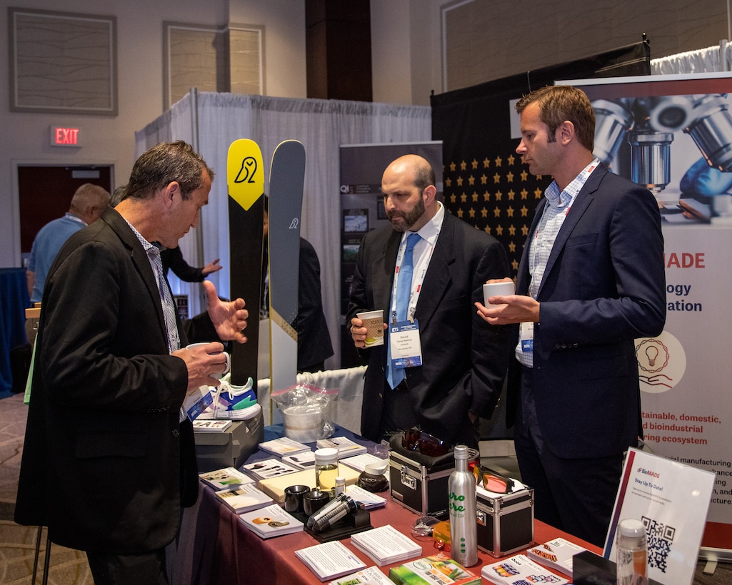 Representatives from the DoD Manufacturing Institute, BioMADE, speak to an attendee of the Emerging Technologies for Defense Conference and Exhibition, August 29, 2023. The DoD MIIs seek to revitalize the U.S.’s domestic manufacturing capability through domestic public-private partnerships that enhance America’s strategic competitiveness while enabling the military of tomorrow.