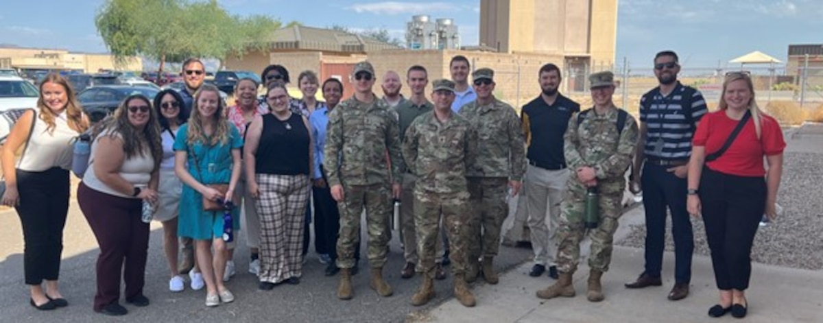 U.S. Air Force Col. Joel Luker, fifth from right, deputy commander, Air Force Research Laboratory, or AFRL, and AFRL Junior Force Council members are pictured during the AFRL Junior Force Council Bluing Trip Aug. 8, 2023, at Luke Air Force Base, Ariz. The three-day bluing trip took place Aug. 8-11, 2023. The base hosted junior AFRL members from across the AFRL enterprise to expose members to the Air Force mission. (U.S. Air Force photo / Shannon Tighe)
