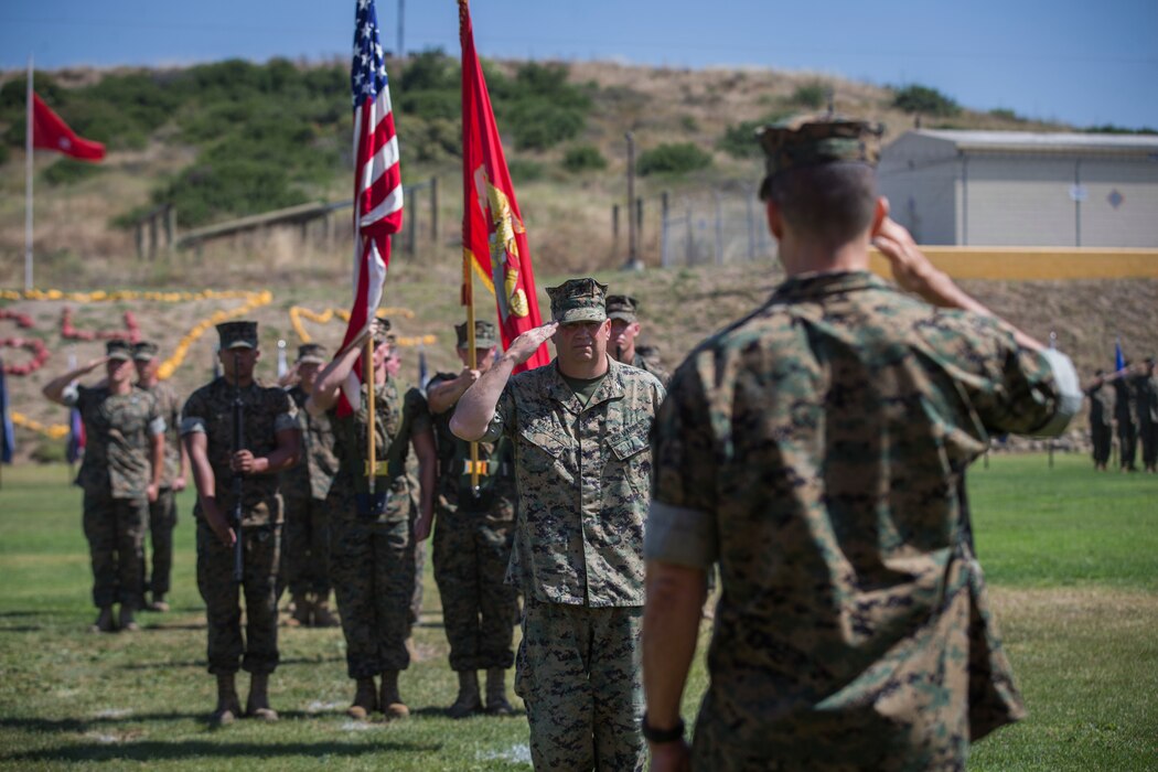 U.S. Marine Col. Jason L. Wallace, the outgoing commanding officer of Deployment Processing Command Reserve Support Unit-West, Force Headquarters Group, Marine Corps Forces Reserve, salutes Brig. Gen. Mark A. Hashimoto, commanding general of Force Headquarters Group, Marine Corps Forces Reserve, during a change of command ceremony at Camp Talega on Marine Corps Base Camp Pendleton, California, July 12, 2019. During the ceremony, Wallace, transferred command to Col. Craig C. Ullman. (U.S. Marine Corps photo by Lance Cpl. Andrew Cortez)
