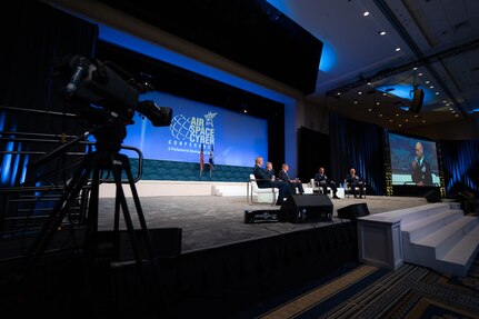 group of Airmen sitting on stage at AFA