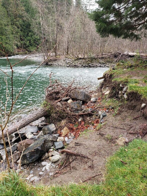 Damage to the Mason Thorson Ells levee looking across the Middle Fork Snoqualmie River.