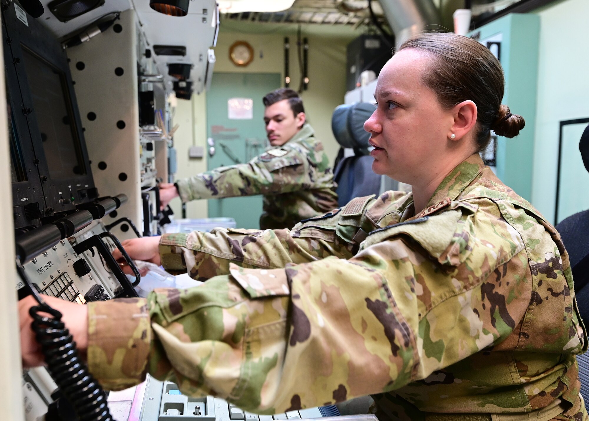 Capt. Katelyn Woodley, Operations Group representative to the 90th Missile Wing Operations Center, conducts a key turn simulated launch alongside 2nd Lt. Charles Read, 320th Missile Squadron deputy missile combat crew commander, in the Missile Procedures Trainer on F.E. Warren Air Force Base, Wyoming, March 27, 2023. MPT training "rides" are regularly conducted for all missileers to ensure personnel readiness
