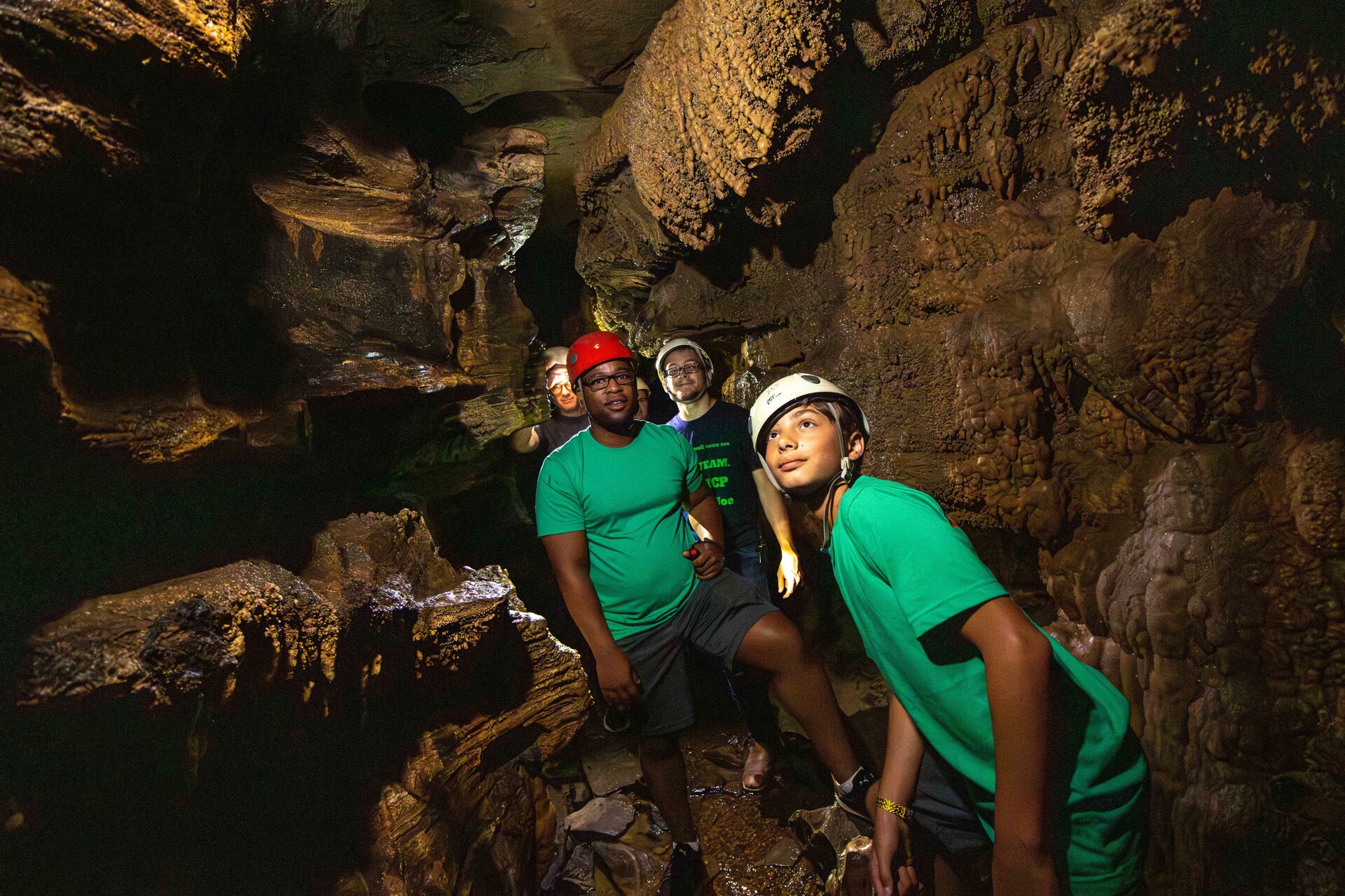 Campers explore a cave during the 2023 Kentucky National Guard Youth Camp at Lake Cumberland 4-H Education Center.