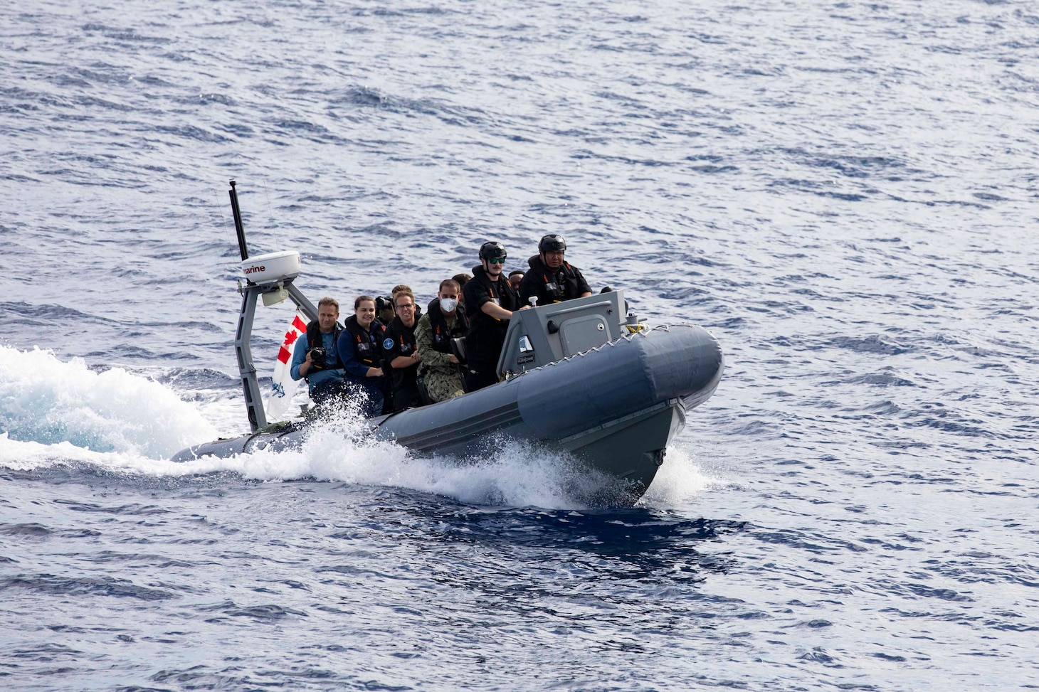 Sailors from His Majesty’s Canadian Ship (HMCS) Ottawa (FFH 341) pilot a rigid-hull inflatable boat (RHIB) toward Arleigh Burke-class guided-missile destroyer USS Ralph Johnson (DDG 114) Sep. 6 in the South China Sea. Ralph Johnson is assigned to Commander, Task Force 71/Destroyer Squadron (DESRON) 15, the Navy’s largest forward-deployed DESRON and the U.S. 7th Fleet’s principal surface force.