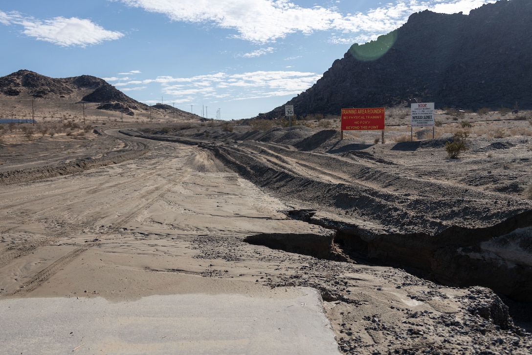 Rain from Tropical Storm Hilary causes a dirt road to partially collapse at Marine Corps Air-Ground Combat Center, Twentynine Palms, California, Aug. 21, 2023. MCAGCC is committed to ensuring effective and efficient recovery actions following extreme weather. (U.S. Marine Corps photo by Lance Cpl. Anna Higman)