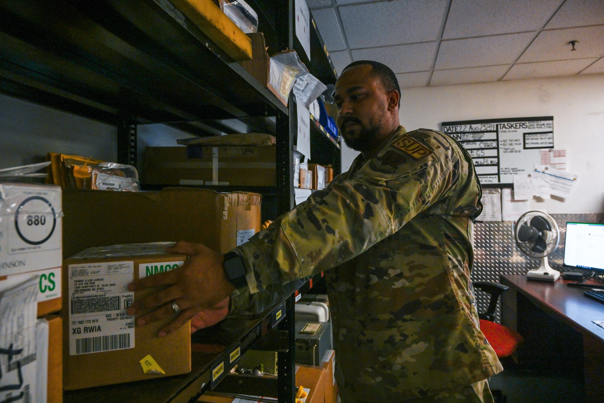 Tech. Sgt. Delvin Marshall, 4th Logistics Readiness Squadron decentralized material supply non-commissioned officer in charge, places a mission impaired capabilities awaiting parts asset into the tail number bin hold area at Seymour Johnson Air Force Base, Seymour Johnson Air Force Base, North Carolina, Aug.. 22, 2023.