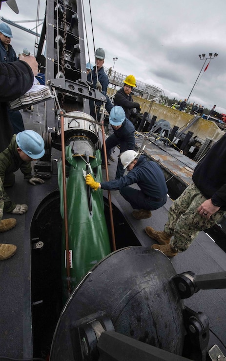 Sailors load munitions onto the fast attack submarine USS Seawolf (SSN 21) at Naval Magazine Indian Island, Washington March 28, 2022. Indian Island is the U.S. Navy’s only deep-water ammunition port on the West Coast, where the installation can provide conventional ordnance support to vessels ranging from destroyers to submarines and aircraft carriers. (U.S. Navy photo by Mass Communication Specialist 2nd Class Gwendelyn L. Ohrazda)
