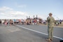 Lt. Cmdr. Sam Clement, executive officer, Naval Magazine Indian Island, speaks to race participants at Naval Magazine Indian Island during the Deer Run in Port Hadlock, Washington, August 13, 2022. About 150 runners and walkers participated in this year’s 5k and 1-mile Deer Run, which NMII typically hosts every year in the summer. (U.S. Navy photo by Mass Communication Specialist Seaman Apprentice Sophia H. Brooks)