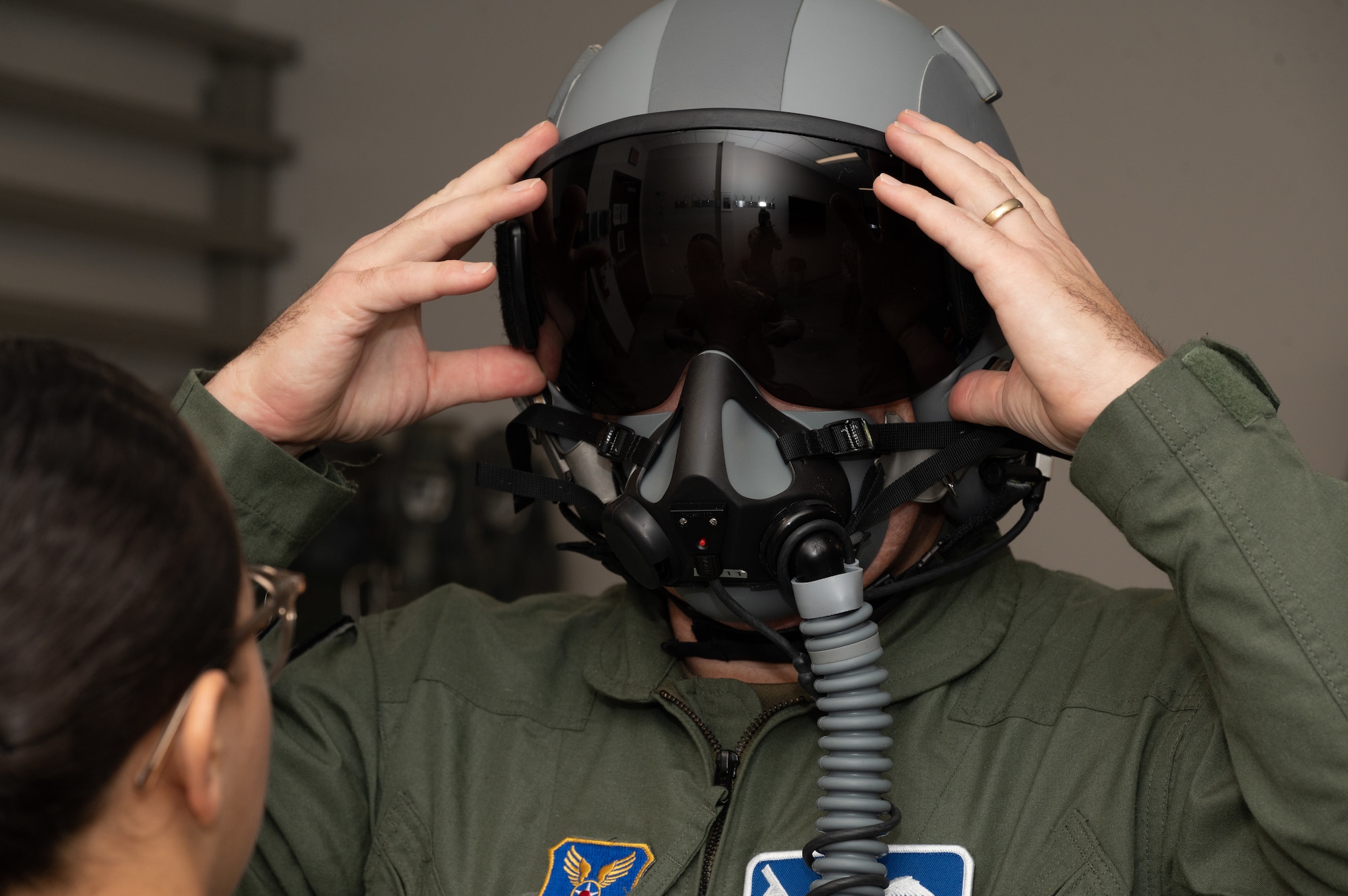 Royal Air Force Air Vice-Marshal Allan Marshall, Ministry of Defense assistant chief of defense staff, gets fitted for a helmet at Whiteman Air Force Base, Mo., Sept. 8, 2023. Marshall flew in a U.S. Air Force B-2 Spirit stealth bomber to familiarize himself with its capabilities. (U.S. Air Force photo by Airman 1st Class Joseph Garcia)