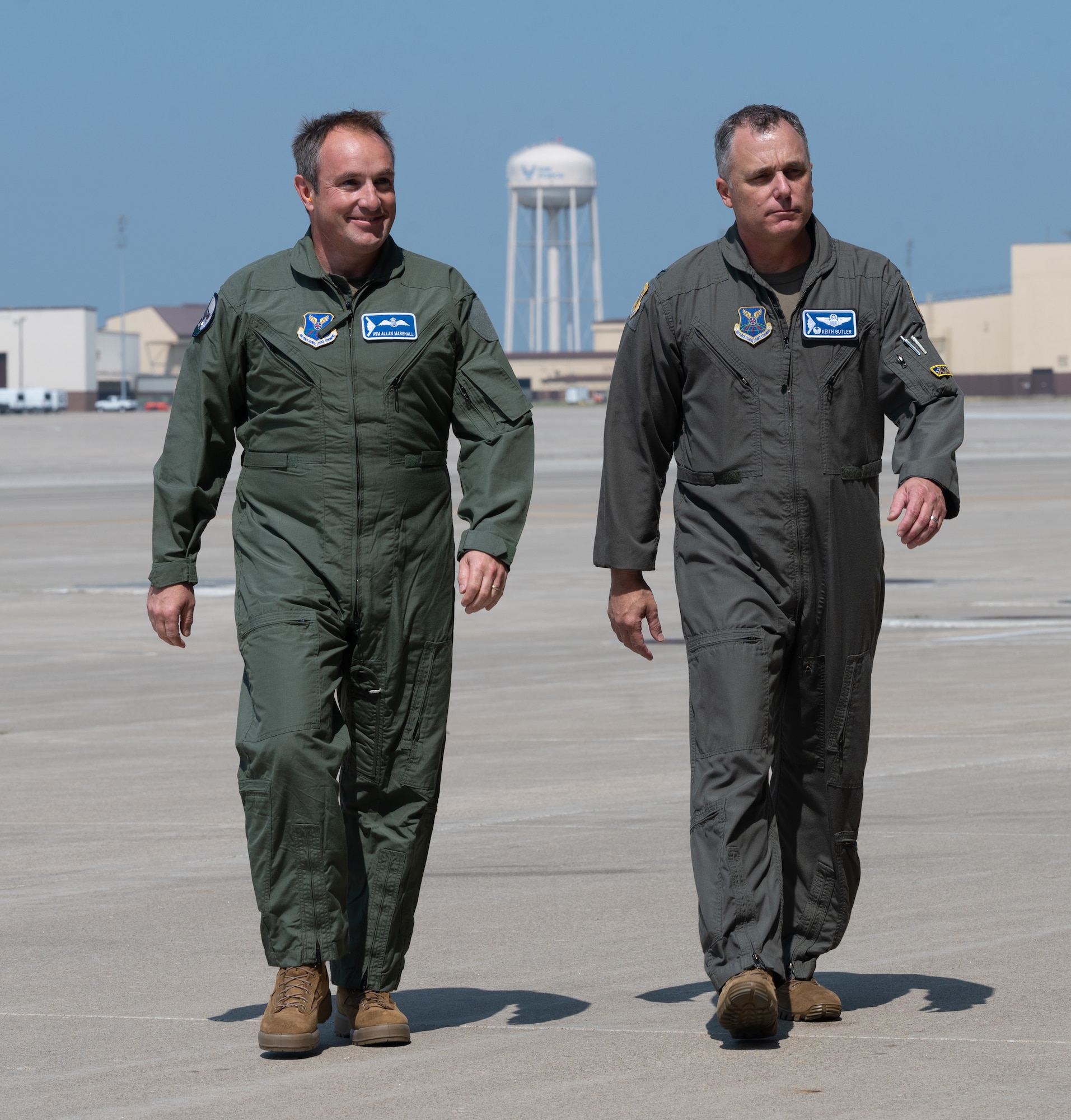 Royal Air Force Air Vice-Marshal Allan Marshall, Ministry of Defense assistant chief of defense staff, left, and U.S. Air Force Col. Keith Butler, 509th Bomb Wing commander, right, walk across the flightline at Whiteman Air Force Base, Mo., Sept. 8, 2023. Marshall’s visit was intended to strengthen the U.K.-U.S. relationship by meeting Airmen and taking a flight in the world’s premiere bomber. (U.S. Air Force photo by Airman 1st Class Joseph Garcia)