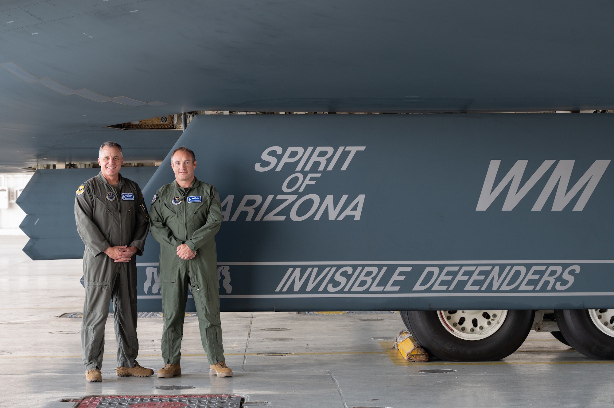 U.S. Air Force Col. Keith Butler, 509th Bomb Wing commander, left, and Royal Air Force Air Vice-Marshal Allan Marshall, Ministry of Defense assistant chief of defense staff, right, pose next to a U.S. Air Force B-2 Spirit stealth bomber at Whiteman Air Force Base, Mo., Sept. 8, 2023. Marshall’s visit was intended to strengthen the U.K.-U.S. relationship by meeting Airmen and taking a flight in the world’s premiere bomber. (U.S. Air Force photo by Airman 1st Class Joseph Garcia)
