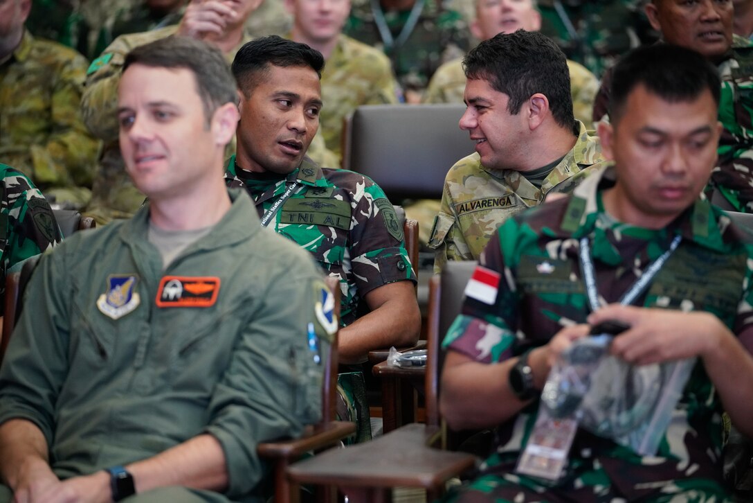 The training audience for the staff exercise portion of Super Garuda Shield 2023 (SGS23) exchange pleasant greetings before the opening ceremony, August 31, 2023, Surabaya Indonesia. #SuperGarudaShield 2023 is an annual exercise that has significantly grown in scope and size since 2009. #SGS2023 is the second consecutive time this exercise has grown into a combined and #joint event, highlighting the 6 participating and 12 observing nations’ commitment to #partnership and a #freeandopenindopacific. (US Air National Guard Photo by Air Force Master Sgt. Andrew Lee Jackson)