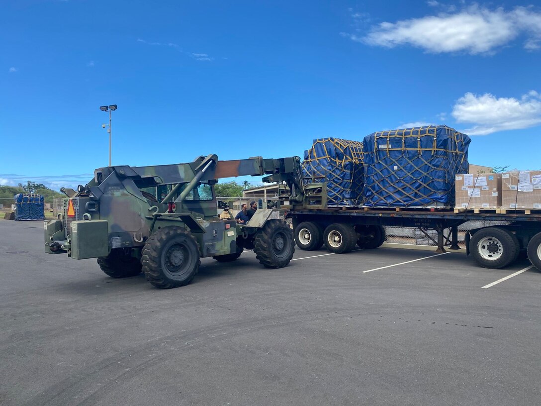 Soldiers assigned to the 871st Engineer Vertical Construction Company drives a Skytrak Fork lift to off load supplies, Aug. 2023. Stationed at the Kaoru Moto U.S. Army Reserve Center, located in Wailuku, Maui Soldiers from various units within the 9th MSC have combined efforts with the 871st Engineer Vertical Construction Company (EVCC) as part of Task Force Pueo, stepping in to aid their fellow Soldiers and civilians impacted by the wildfires.