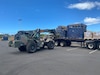 Soldiers assigned to the 871st Engineer Vertical Construction Company drives a Skytrak Fork lift to off load supplies, Aug. 2023. Stationed at the Kaoru Moto U.S. Army Reserve Center, located in Wailuku, Maui Soldiers from various units within the 9th MSC have combined efforts with the 871st Engineer Vertical Construction Company (EVCC) as part of Task Force Pueo, stepping in to aid their fellow Soldiers and civilians impacted by the wildfires.