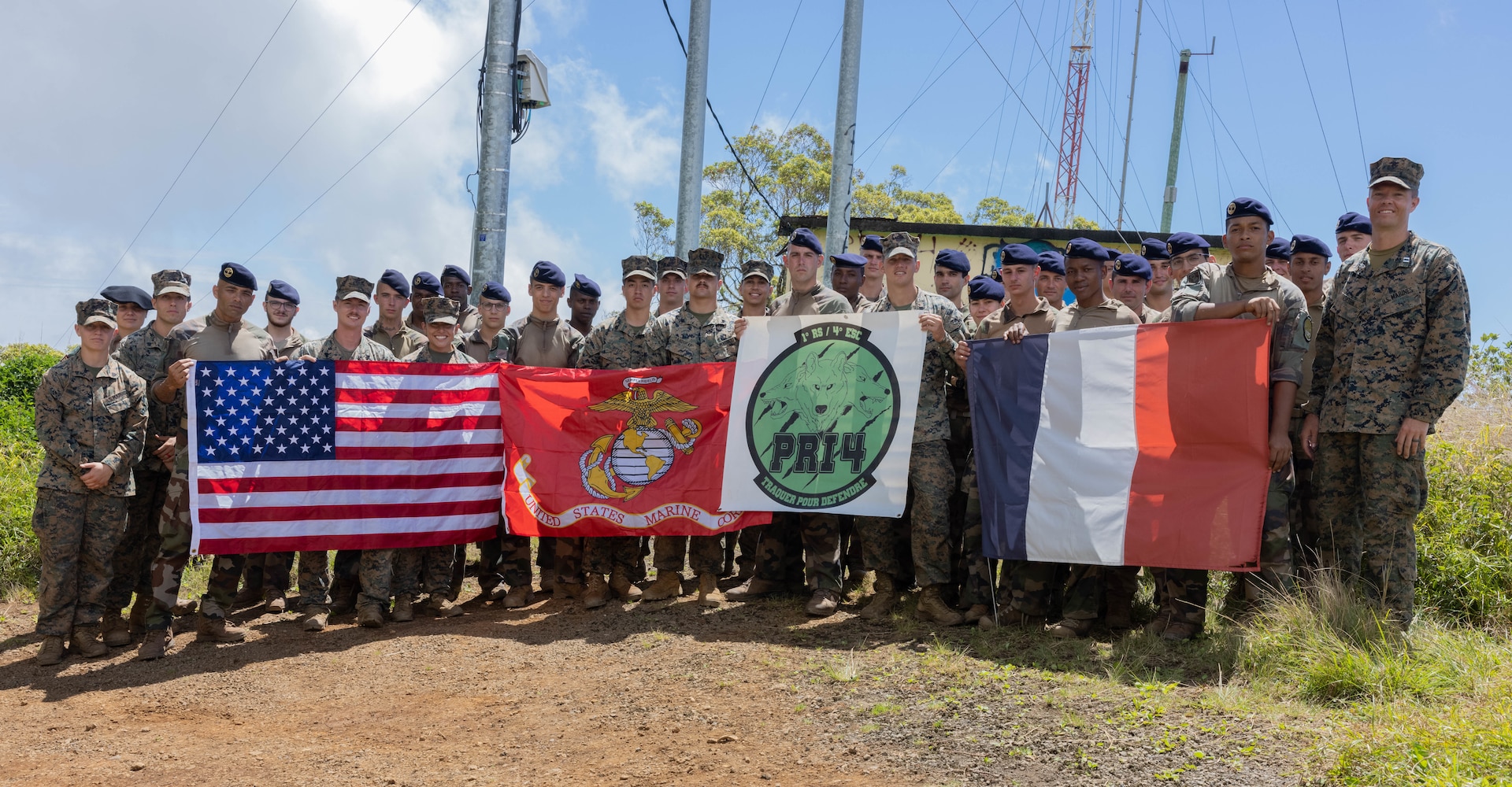 U.S. Marines with Headquarters and Service Battalion, U.S. Marine Corps Forces, Pacific, and members of the French Marine Infantry Regiment in French Polynesia, French Armed Forces, pose for a group photo at the peak of Mount Marau in Arue, Tahiti, French Polynesia, Sept. 6, 2023. The event provided an opportunity for members of both militaries to foster a deeper understanding of each others’ traditions while building mutual respect among Allies and partners within the Indo-Pacific region. (U.S. Marine Corps photo by Cpl. Haley Fourmet Gustavsen)