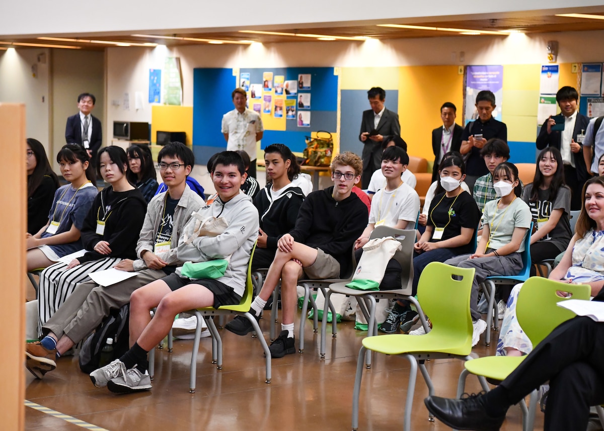 American and Japanese students listen to a guest speaker during the Student Educational Exchange and Dialogue (SEED) project at Yokota Air Base, Japan, Sept. 10, 2023. Throughout the two-day event, teams of students collaborated and competed for five distinguished awards which were announced during the closing ceremony. (U.S. Air Force photo by Staff Sgt. Spencer Tobler)
