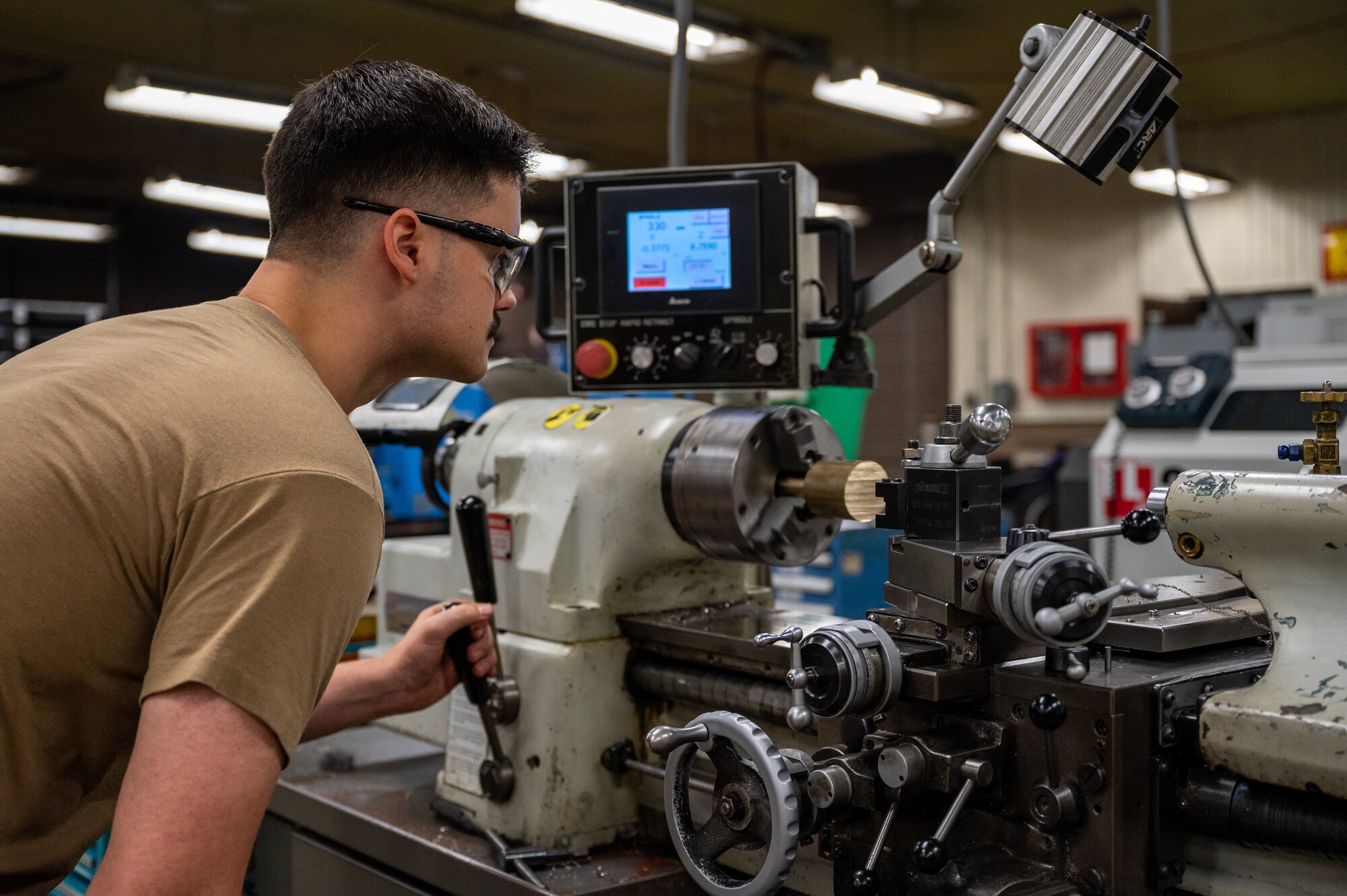 U.S. Air Force Staff Sgt. Gregory Bailey, 51st Maintenance Squadron metals technician, operates a lathe at Osan Air Base, Republic of Korea, Sept. 7, 2023. Metals technicians utilize a range of machinery for fabricating and repairing essential aircraft components that are critical to maintaining the readiness and combat capability of A-10C Thunderbolt IIs and F-16 Fighting Falcons assigned to the 51st Fighter Wing. (U.S. Air Force photo by Staff Sgt. Thomas Sjoberg)