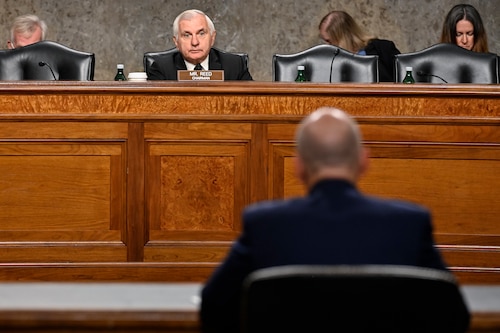 Sen. Jack Reed speaks with Air Force Vice Chief of Staff Gen. David W. Allvin during a Senate Armed Services Committee hearing on Capitol Hill for his nomination to be the next Air Force chief of staff, in Washington, D.C., Sept. 12, 2023. (U.S. Air Force photo by Eric Dietrich)