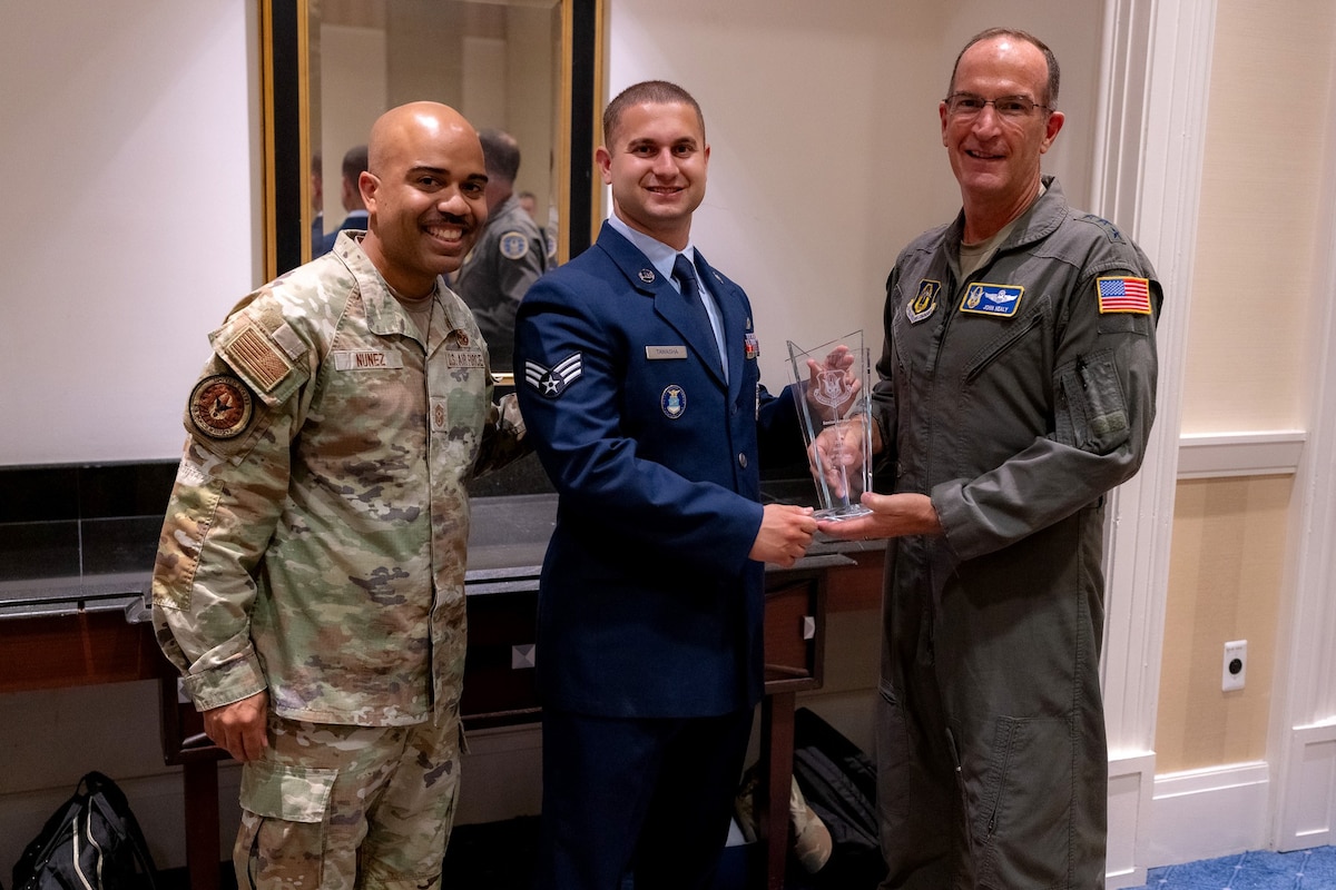 Photo of Lt. Gen. John P. Healy, Chief MAster Sgt Israel Nunez and Senior Airman Jacob Tawasha