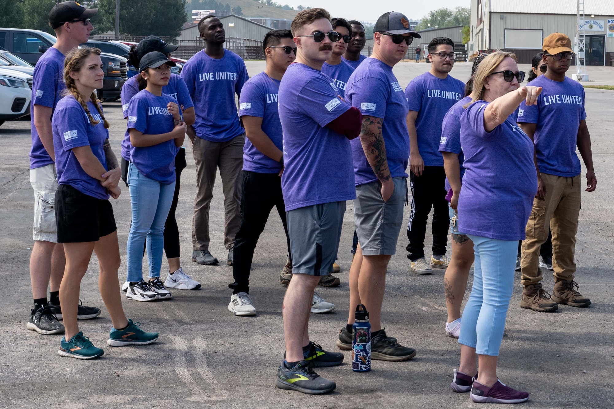 Volunteers from Ellsworth Air Force Base receive directions during a volunteer event at the Central States Fairgrounds in Rapid City, South Dakota, Sept. 7, 2023. Members of Ellsworth spent the day scattered throughout the city lending a hand to their local community. (U.S. Air Force photo by Spc3 Adam Olson)