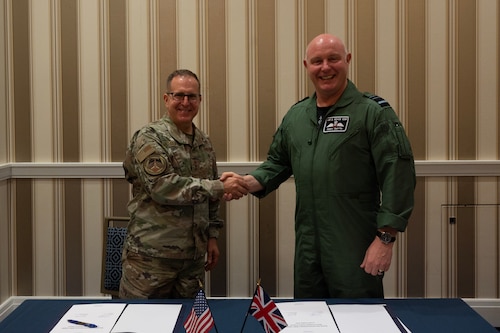 Lt. Gen. Jim Slife, U.S. Air Force Deputy Chief of Staff for Operations, and Royal Air Force's Air and Space Commander Air Marshal Harv Smyth sign a Combined Vision Statement on Agile Combat Employment in National Harbor, Md., Sept. 12, 2023. (U.S. Air Force photo by Tech. Sgt. Nick Z. Erwin)