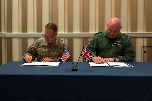 Lt. Gen. Jim Slife, U.S. Air Force Deputy Chief of Staff for Operations, and Royal Air Force's Air and Space Commander Air Marshal Harv Smyth sign a Combined Vision Statement on Agile Combat Employment in National Harbor, Md., Sept. 12, 2023. (U.S. Air Force photo by Tech. Sgt. Nick Z. Erwin)