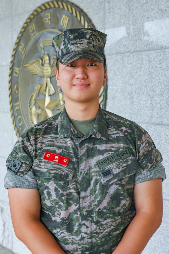 U.S. Marine Corps Sgt. Sophia Green poses for a photo in front of the ROK Marine Corps emblem at Camp Baran, Republic of Korea Marine Corps Headquarters, during Exercise Ulchi Freedom Shield 23. Green, a native of San Diego, Calif., served at the Camp Commandant during UFS 23. Ulchi Freedom Shield is an annual exercise designed to strengthen the combined defense posture and Alliance response capabilities based on scenarios that reflect diverse threats within the security environment. This creates an opportunity for ROK and III MEF Marines to train together while conducting the live, virtual, and constructive exercise events that reaffirming the U.S.’s ironclad commitment to the defense of the ROK. (U.S. Marine Corps photo by Maj. Gabriel Adibe)